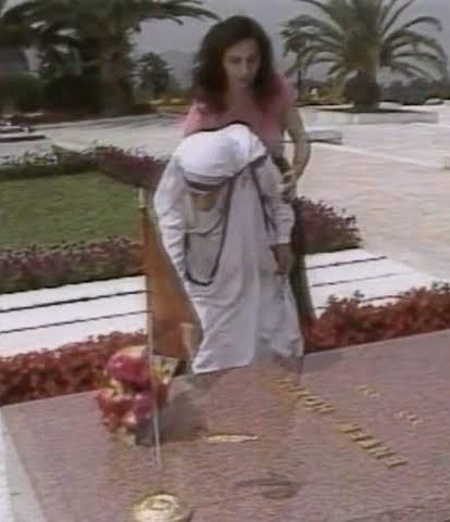 Mother Teresa at Enver Hoxha's grave in Tirana.